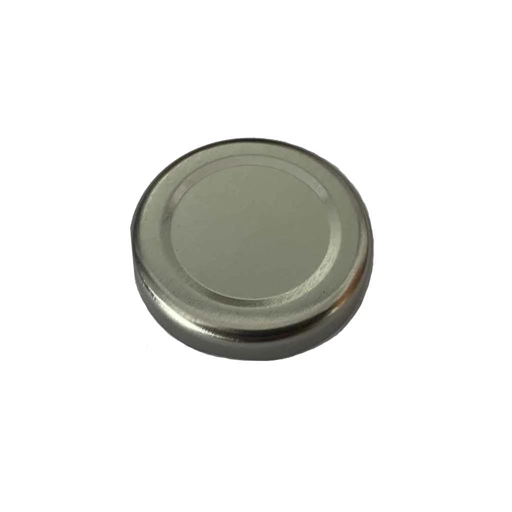 Metallic silver circular object on a white background